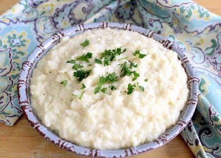 Smashed Cauliflower with White Cheddar Sauce