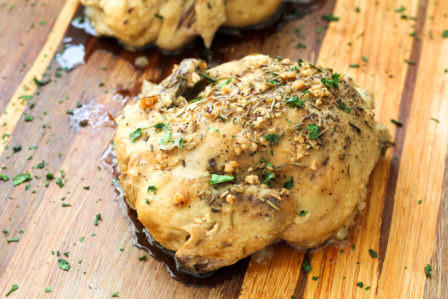 Crock Pot Cornish hens on a cutting board